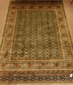 Persian Bokhara design green ground rug/wall hanging,