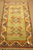 Turkish pale green ground rug, 213cm x 120cm Condition Report <a href='//www.