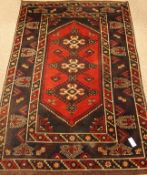 Persian Shiraz red and blue ground rug,