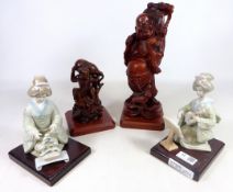 Pair of bookends modelled as geisha girls and two carved wooden Oriental figures (4)