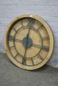 Circular wood framed wall clock with wrought metal dial and hands,