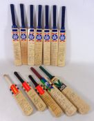 Collection of signed miniature cricket bats,