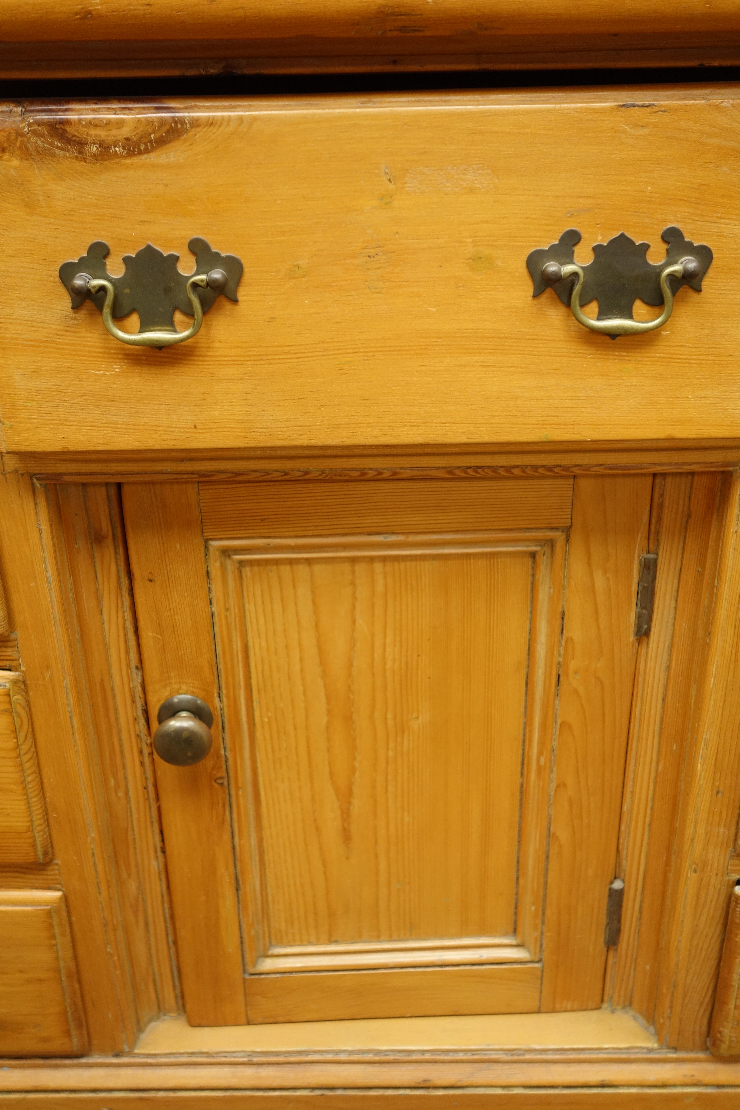 Victorian pine dresser, nine drawers and centre panelled cupboard, - Image 2 of 2