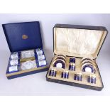 Set of six cased early 20th Century Aynsley coffee cans and saucers with blue ground and gilt