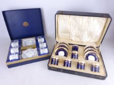 Set of six cased early 20th Century Aynsley coffee cans and saucers with blue ground and gilt