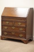 George III oak bureau, fall front with fitted interior above two short and two long drawers,