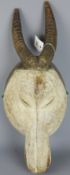 Tribal Masks; West African carved wood mask in the form of a Antelope with white Kaolin pigment,