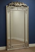 Large rectangular French style wall mirror in silvered frame with carved pediment,