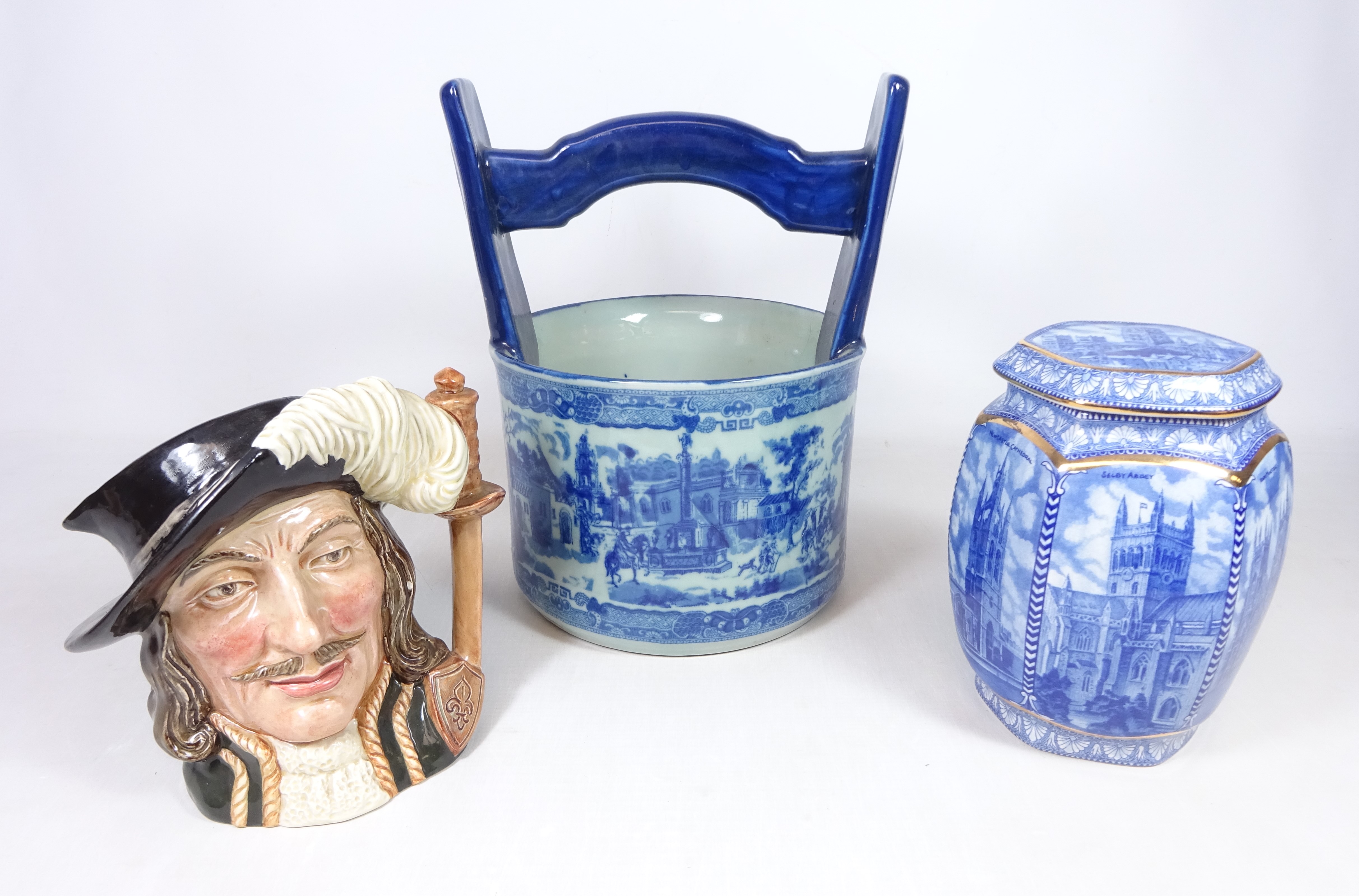Royal Doulton character jug 'Athos' Ironstone blue and white planter H30cm and a Ringtons lidded