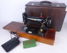 Vintage cased electric Singer sewing machine,