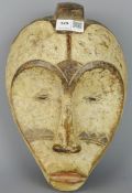 Tribal Masks; West African, Gabon, carved wood Ngil, Fang mask,