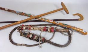Souvenir walking stick with various badges two other walking sicks and a traditional Hungarian