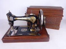 Early 20th Century Singer Sewing machine in wood case Condition Report <a