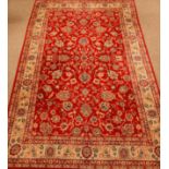 Persian Ziegler design red ground rug, interlacing stylized floral field,