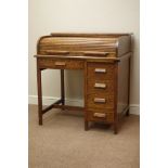 Early 20th century oak tambour roll top desk, four drawers,