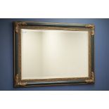 Green lacquered and gilt framed wall mirror, bevelled glass,