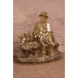 Composite stone figure of a gentleman on a bench,