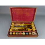 Edwardian miniature Parlour Croquet set, in mahogany case,