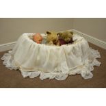 Wicker crib with drapes,