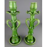 Pair of tall Arts and Crafts green glaze candlesticks with bamboo shaped stems,