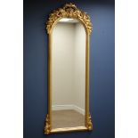 Ornate gilt frame full length mirror, arched top with shell pediment,