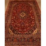 Persian Kashan red ground rug carpet,trailing stylised floral design,