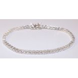 Silver tennis bracelet set with cubic zirconia stamped 925 Condition Report <a