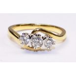 Three stone diamond cross-over ring hallmarked 18ct (diamonds approx 0.