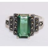 Large silver green stone and marcasite ring in stepped setting stamped 925 Condition