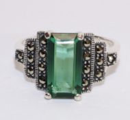 Large silver green stone and marcasite ring in stepped setting stamped 925 Condition