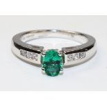 18ct white gold oval emerald and channel set diamond ring hallmarked - emerald approx 1 carat