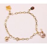 14ct gold charm bracelet stamped 585 approx 7gm