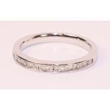 18ct white gold channel set brilliant cut diamond half eternity ring (unmarked)