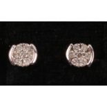 Pair of white gold diamond ear-rings hallmarked 9ct