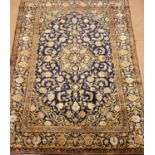 Persian Kashan blue ground rug carpet, central rosette medallion repeating in field and boarder,