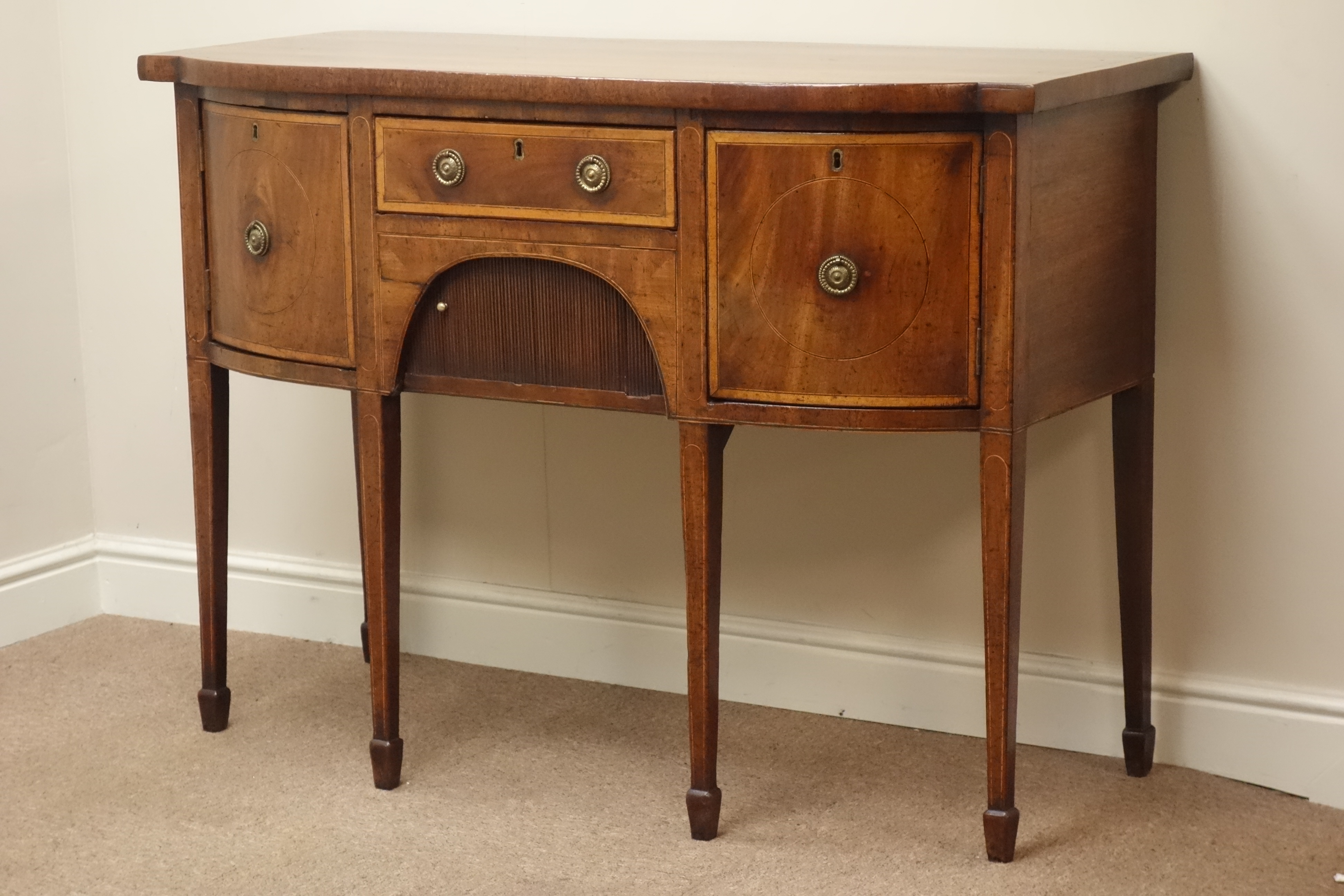 Small Regency satinwood cross banded mahogany bow break front sideboard,