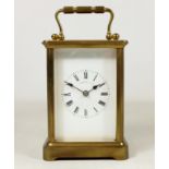 20th century brass carriage clock, in original hinged leather case with key,