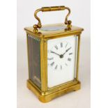 Early 20th century brass carriage timepiece with white enamel Roman dial,