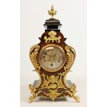 Early 20th century small walnut and ebonised ormolu mounted mantel clock, silvered engraved dial,