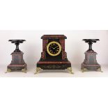 Victorian black slate and red marble clock garniture, with engraved and gilt scroll and swag detail,