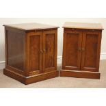 Pair of walnut panelled side cabinets with figured inserts, fitted with two doors and a slide,