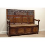 17th century & later oak box settle with strap work and lunette carved fielded panel back,