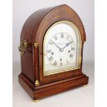 Edwardian mahogany lancet shaped mantel clock, silvered dial signed 'Carnerer Cuss & Co London',