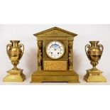 Late 19th brass Neoclassical clock garniture, inset with embossed metal friezes,