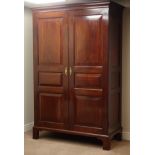 Georgian figured mahogany wardrobe, two panelled doors, panelled oak back, on bracket feet, W138cm,