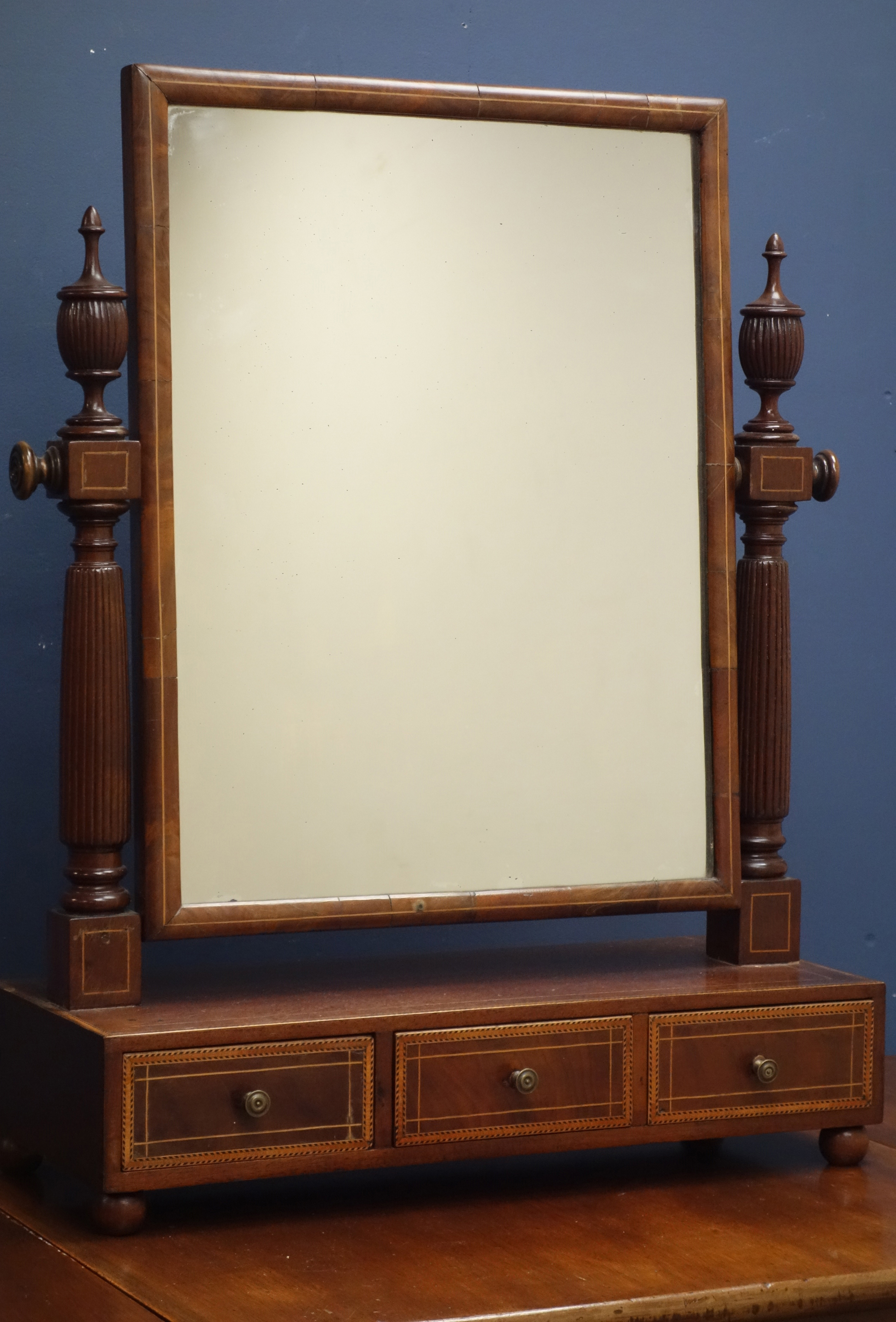 19th century inlaid mahogany toilet mirror, upright plate on fluted supports,