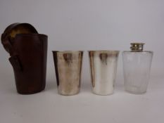 Early 20th century glass spirit flask with EPNS crew top and two tumblers in brown leather case