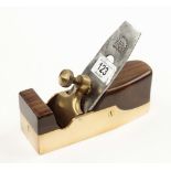 A polished brass smoother with rosewood infill and brass lever G+