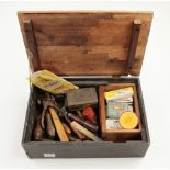 A quantity of leather workers tools in pine box G