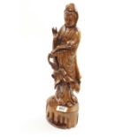A Buddhist statue of Lady of Mercy & Compassion made of resin but wood grained